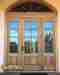 Wood door during restoration by Pelican Painting Company in Sarasota