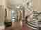 Foyer with dramatic staircase painted by Pelican Painting Company in Sarasota