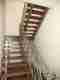Wood staircase refinished by Pelican Painting Company in Sarasota